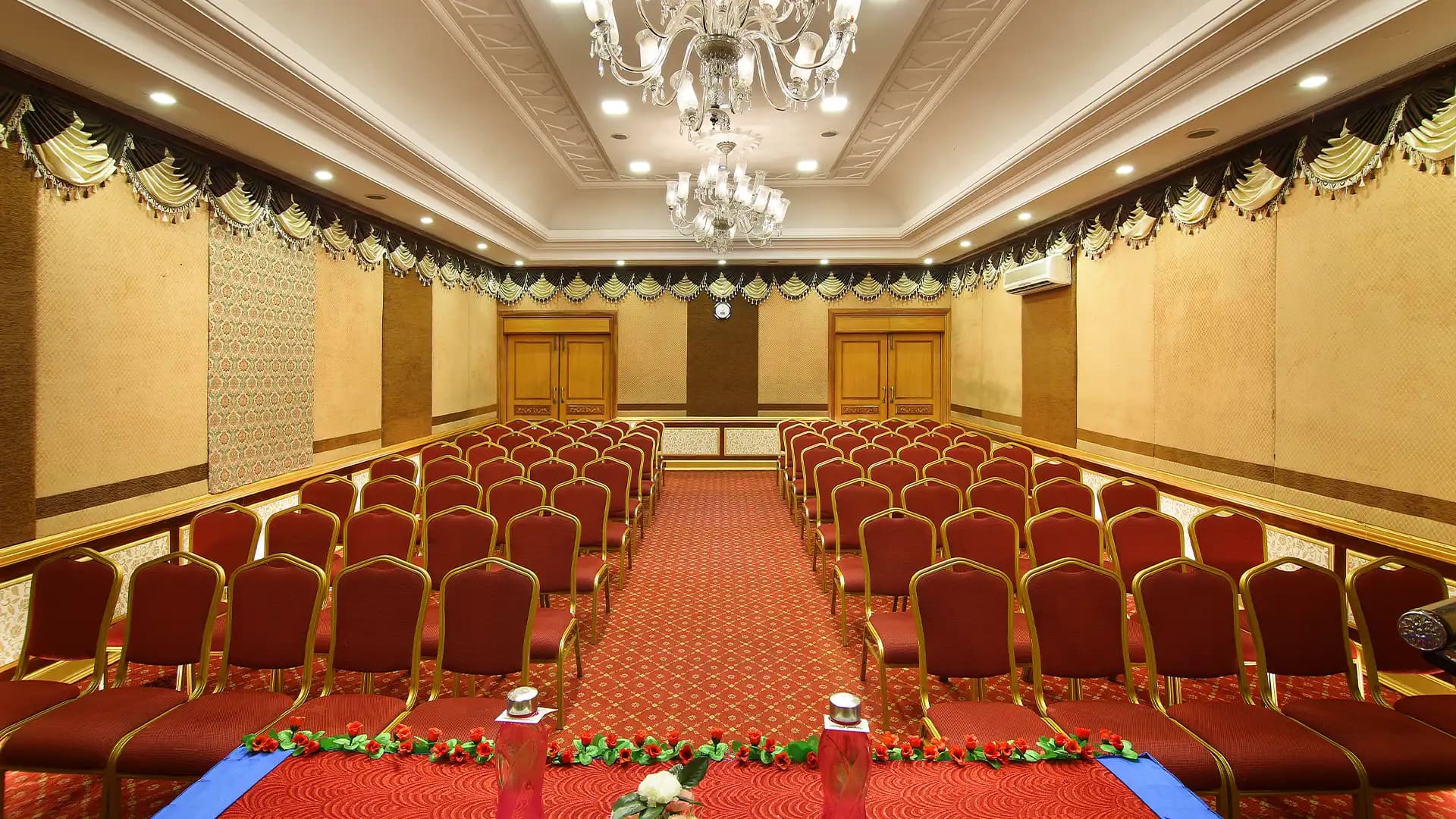 Viceroy Hall banquet hall in Madurai with tall ceilings and a wooden dance floor